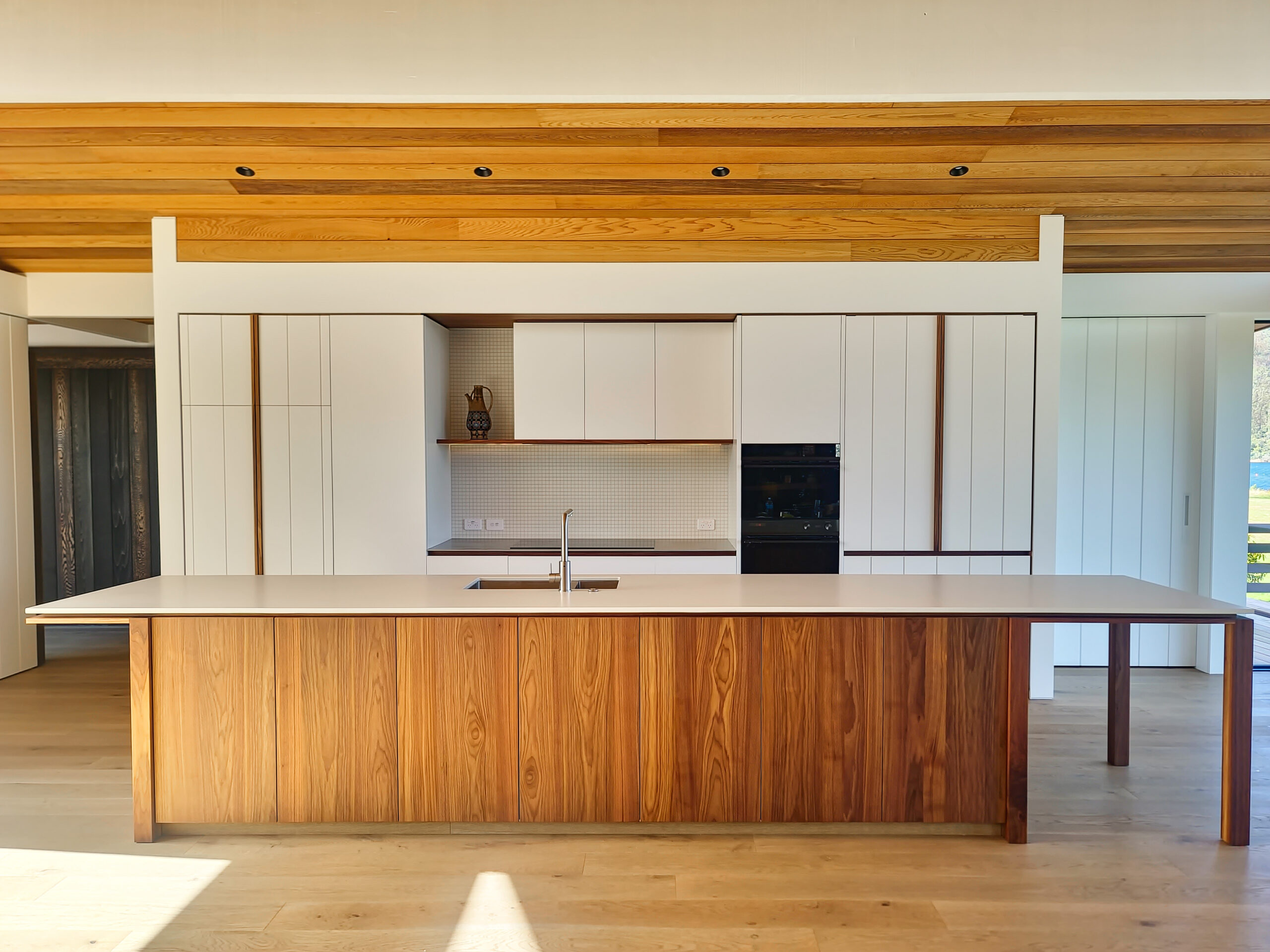 Beautiful walnut feature in white kitchen cabinetry